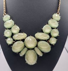 Gorgeous Bib Collar gold tone necklace features faceted light green different sizes oval and rounds geometric pattern.  Chain is 17" long with 3" extension. The geometric part is 4 "wide and  3" long and in very good pre-loved condition.   You can notice some sign of wear on the chain. Vintage Green Statement Necklace, Bib Collar, Wedding Jewellery Necklace, Gold Tone Necklace, Collar Necklace, Wedding Necklace, Green Gold, Green And Gold, Light Green