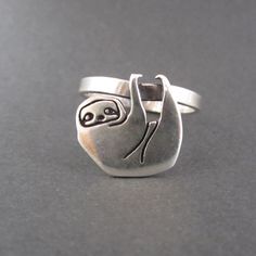 This weird little sloth ring will keep you company throughout your day. My silver charms are soldered to a 1/8 wide sterling silver band in whole sizes 5-10. Your ring will be made to order, so please give me 1-5 business days to make it. Items are shipped without a receipt in a gift box. Sloth Rings, Weird Rings, Sloth Ring, Sloth Jewelry, Minimalist Studs, Rings Silver, Interesting Ideas, Silver Jewels, Jewelry Model