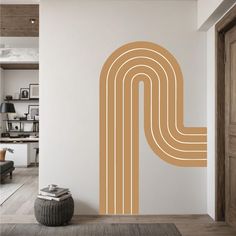 a room with a large wall decal in the shape of a letter p