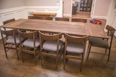 a dining room table with six chairs around it