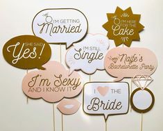 wedding cake toppers are arranged in pink, gold and white with the words i'm getting married