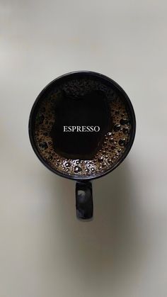 an espresso coffee cup with the word espresso printed on it's side