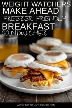 two breakfast sandwiches on a plate with bacon and eggs in the background, text reads weight watchers make ahead freezer friendly breakfast sandwiches