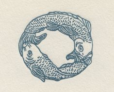 two fish swimming in a circle on paper