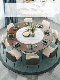 a round dining table with chairs and plates on it in the middle of a room