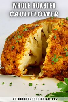 a plate with cauliflower cut in half and the words whole roasted cauliflower on it