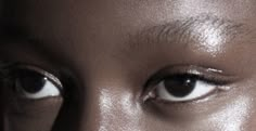 a woman's eyes are shown in this close - up photo from the side