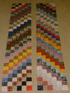 two pieces of colorful fabric sitting on top of a wooden floor next to each other