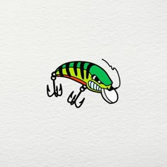 a green and yellow striped fish on white paper