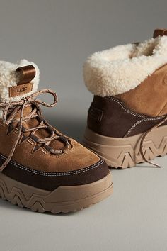 The UGG TerreTrail Cozy Lace-Up Boots combine comfort and style with waterproof suede, a curly faux-fleece collar, and a soft faux-fleece lining, while its Spider Rubber® outsole ensures reliable traction for winter weather. | TerreTrail Cozy Lace-Up Boots by UGG in Beige, Women's, Size: 5, Polyester/Wool/Rubber at Anthropologie Ugg Lace Up Boots Outfit, Women’s Winter Boots, Winter Boots 2024, Uggs Snow Boots, Cute Winter Boots For Women, Winter Boots Aesthetic, Cute Hiking Boots, Trendy Snow Boots, Trendy Winter Boots