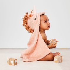 Unicorns may have mystical powers, but our whimsical baby towel has the unmatched ability to keep little ones warm and cozy after the bath, pool or beach. Crafted of organic cotton with a horned hood, you won't believe something so soft and snuggly could be real. Spoiler: It is!    Unicorn baby towel with hood   Organic cotton exclusive of decoration   Machine wash cold; tumble dry low   Do not bleach   Made in Turkey Hooded Baby Towel, Kids Bedding Sets, Little Dragon, Baby Towel, Organic Cotton Baby, Kids Bath, Hooded Towel, Be Real, Kids Bedding