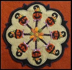 this is an image of a patchwork design with pumpkins and witches on it