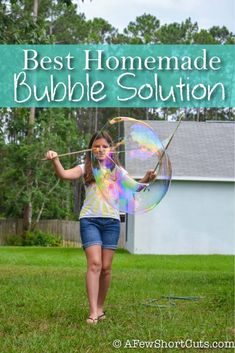 a girl holding a bubble wand in her hand and the words best homemade bubble solution