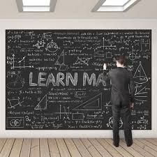 a man writing on a blackboard with the words learn ma