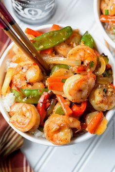 shrimp and vegetable stir fry in a white bowl