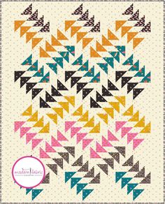 an image of a quilt pattern with different colors and shapes on it, including triangles