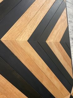 a close up of a wooden floor with black and brown lines on it's sides