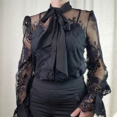 Black Lace Long Sleeve Top With Camisole A Semi-Sheer Lace Top Featuring A Tie Neck Collar, Bishop Sleeves With Elasticized Cuffs, Eyelash Lace Trim, And A Removable Camisole Lining. Shell: 100% Nylon Lining: 100% Polyester All Measurements Are Approximate Medium: 19.5" Pit To Pit, 24" Length Fitted Lace Top Blouse For Office, Black Non-stretch Tops For Work, Fitted Lace Top For Workwear, Fitted Lace Top For Work, Black Lace Top For Workwear, Black Lace Top For Work, Chic Black Lace Blouse, Black Non-stretch Blouse For Night Out, Fitted Black Lace Blouse