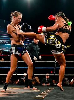 two women kick punches at each other in a boxing ring