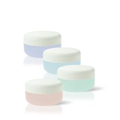 three jars with pastel colors on the lids