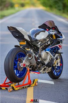 a motorcycle is being worked on in the street