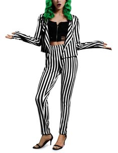 a woman in black and white striped suit with green hair standing on one leg, her arms out to the side