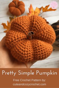 a crocheted pumpkin is being held by someone's hand with the text, pretty simple pumpkin free crochet pattern