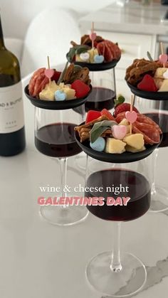 wine and cheese night with valentine's day appetizers on the goblets