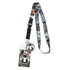 a black and white lanyard with an evil face on the front, and a red eye