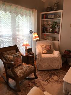 a living room filled with furniture and a lamp