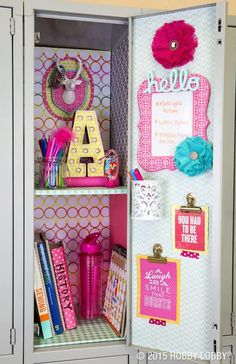 an open locker with school supplies and decorations on the inside, including magnets, pens, paper clips, and other personal items