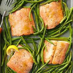 salmon and green beans in a pan with a fork