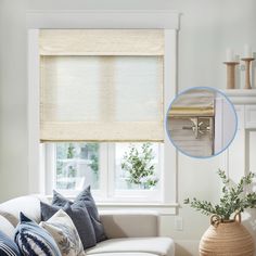 a living room with white furniture and window coverings