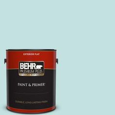 a can of behr paint on a gray background