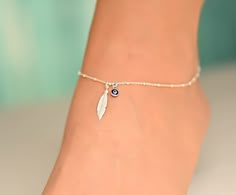 This anklet has a feather charm with an evil eye. The ankle bracelet is sterling silver 925. It is a dainty piece of jewelry that is great for the summer. The anklet has an extension so it can be adjusted to fit comfortably with different shoes. I can also customize the size for you, so feel free to message me if you need a custom order, or if you have any questions. Evil Eye Anklet Silver, Anklet Designs Beads, Evil Eye Jewelry Bracelet, Evil Eye Bracelet Silver, Ankle Bracelets Boho, Evil Eye Anklet, Silver Anklets Designs, Silver Bracelet For Women, Cute Anklets