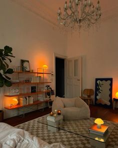 a living room filled with furniture and a chandelier