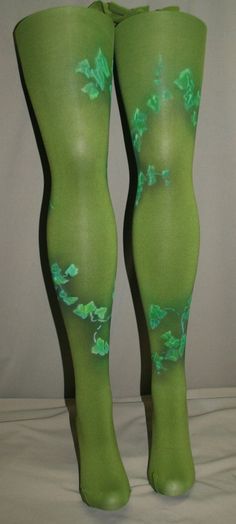 the legs of a woman wearing green stockings