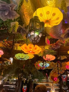 the ceiling is decorated with colorful lights and umbrellas