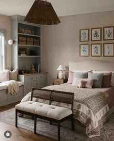 a bed room with a neatly made bed next to a window and a bench in front of it