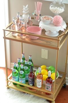 a bar cart filled with drinks and candy