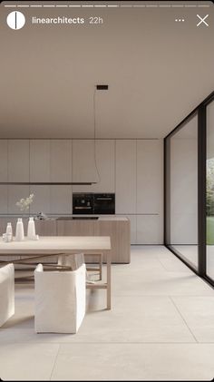 an open kitchen and dining room with sliding glass doors