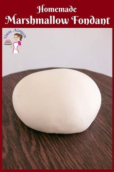 a close up of a white object on a table with the words homemade marshmallow fondant