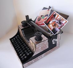 an old fashioned typewriter with pictures on it