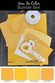 the color scheme for this card is yellow and has white flowers on it, along with some