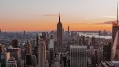 the skyline of new york city at sunset