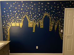 a bathroom decorated with gold confetti and blue walls