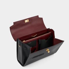 The Mortimer bag is beautifully crafted, inside and out. It is handmade in Florence from the finest, black-hued leather, selected for both its gleam and durability. It has several compartments – one zipped, another with our handmade gold 'lip' – with pockets for your phone, cards, earphones and pen. Carry it by the top handle or style it cross-body by the optional long strap. Item number: 5050925183574 Handbags With Compartments, Bag Strap Ideas, Bags Inside, Luxury Leather Bag, Luxury Clutch, Gold Lips, Phone Cards, Black Leather Bag, Fancy Bags