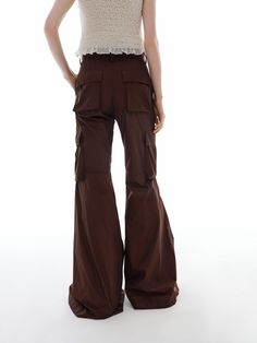 MO&Co. Women's Cargo Style Flared Pants These pants are crafted from lightweight, comfortable material with a crinkled texture. The classic elements of cargo cut and flared hem bring a touch of the 1970s hippie trend. Perfect for everyday wear occasions. Pair with our matching top or jacket for an effortlessly cool look. Features : - Flared leg in cargo style- Wide pockets on the sides- Zip and button closure- Crinkled texture, lightweight fabric Code: MBD1PAT029The back length of size M is 110c Brown Wide-leg Cargo Pants For Spring, Brown Cargo Style Wide-leg Pants, Fitted Wide-leg Parachute Pants With Cargo Pockets, Brown Wide-leg Parachute Pants With Cargo Pockets, Brown Wide-leg Cargo Pants, Brown Flared Cotton Pants, Flared Cargo Pants, Flare Cargo Pants, Style Flared Pants