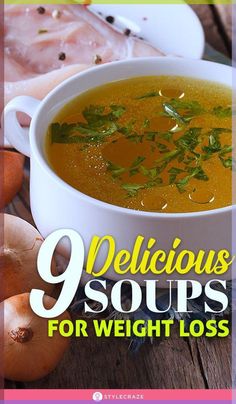 a white bowl filled with soup on top of a wooden table next to vegetables and meat