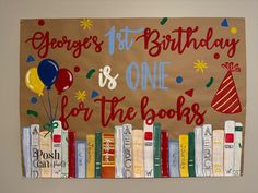 a birthday banner with books and balloons on it